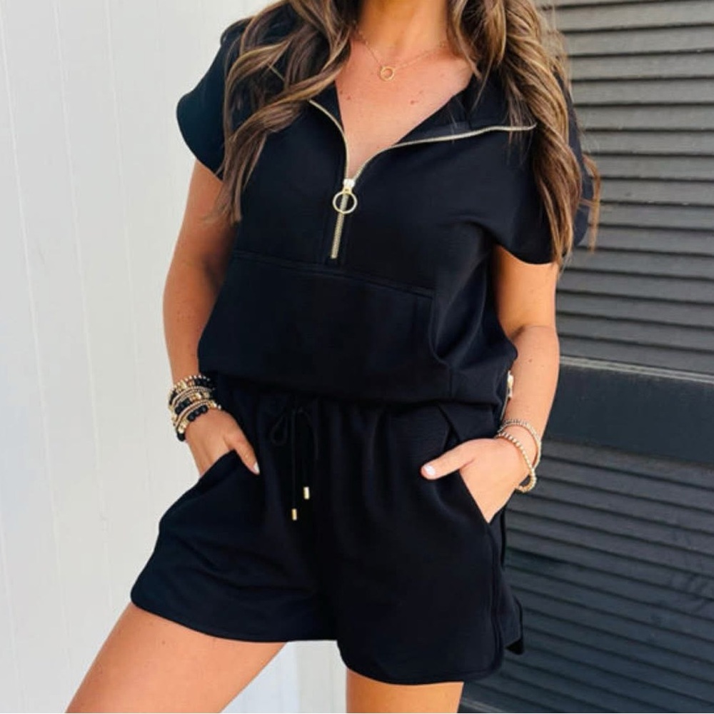 Black two piece short set with gold zippers